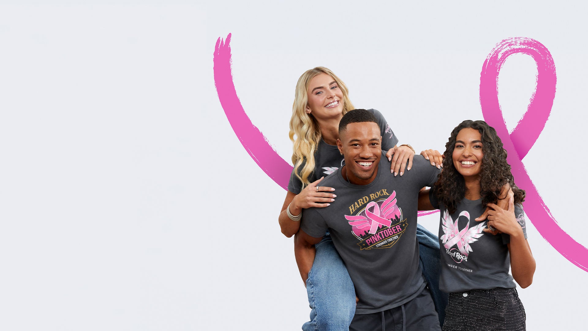 group of adults wearing Rock Shop Pinktober apparel